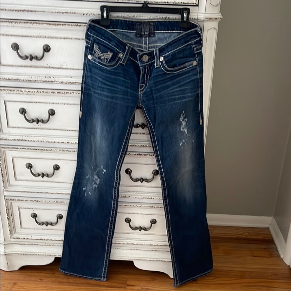 Blue Boot Cut Jeans with Distressed Details